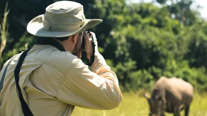 Fotograf in Uganda auf der Ziwa Rhino and Wildlife Ranch